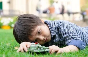 lonely-little-boy-playing-tanks-260nw-1203073396.jpg.d046e8fa2a7a98920aca991ca5751537.jpg