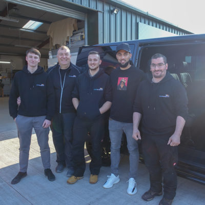 Leeds United FC Striker, Kemar Roofe, standing with the Seat Surgeons Team outside his freshly trimmed Volkswagen Transporter T6 Van.