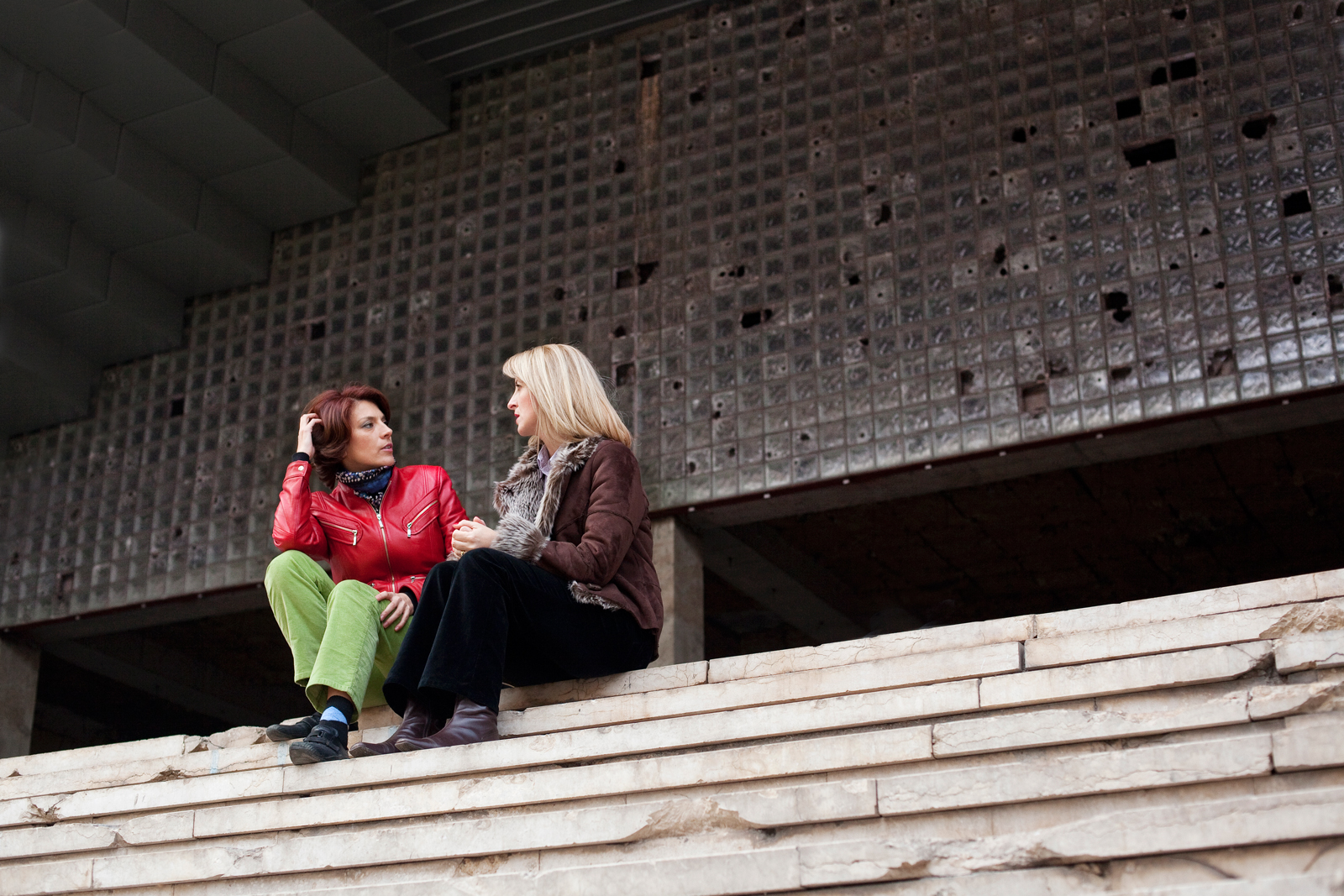 Women sitting on their school steps