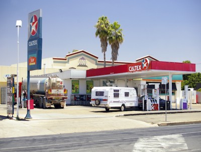 Caltex shares drop more than 9 percent after Chevron divests from all of its stakes.