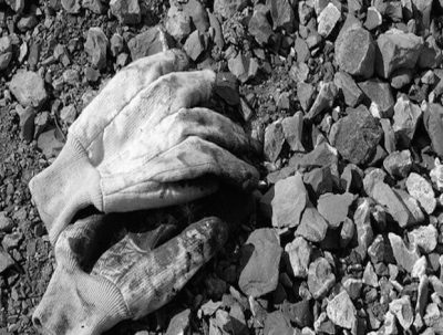 black rocks and some dirty gloves