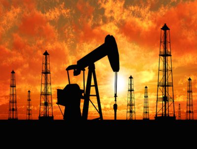 Oil Rig in Texas with sunset in the background