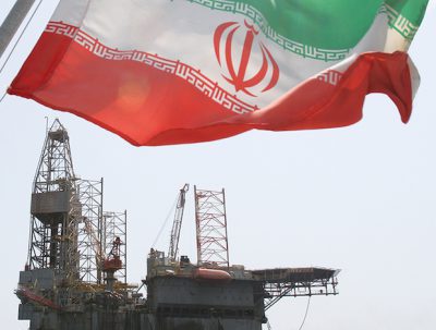 Iran flag flying over oil rig