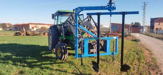 Máquina de pozas acoplada a pala