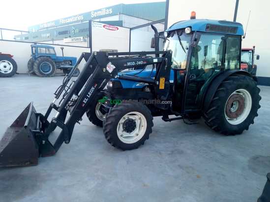 Tractor agrícola - New Holland - TN95FA con Pala Leon 3.40