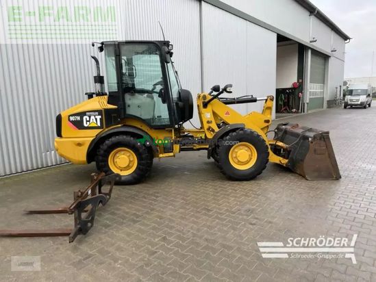 Minicargadora - Caterpillar - 907 h + schaufel + palettengabel