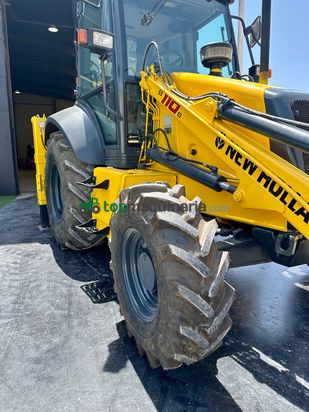 Retro Mixta Cargadora New Holland B110 4PT. 