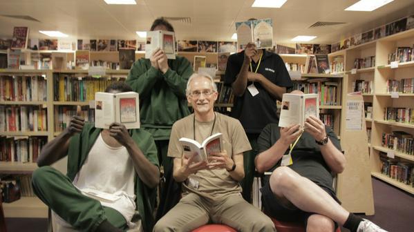 Large hpm thameside prison reading group with volunteer graham reading honour