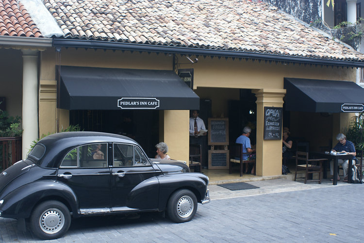 A Morris Minor classic car outside the Pedlar's Inn Cafe in Galle Sri Lanka Pedlar's Inn Cafe