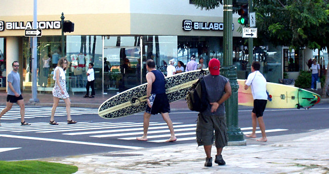 Honolulu Shopping strip in hawaii where shoppers carry surfboards Honolulu Shopping strip