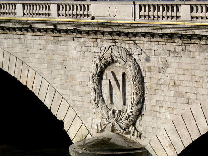 Photo of the a bridge over the river Seine and the N for Napoleon decoration Paris bridge