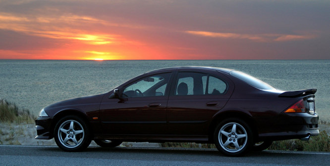 holiday car hire photograph of a holiday rental car by a beach