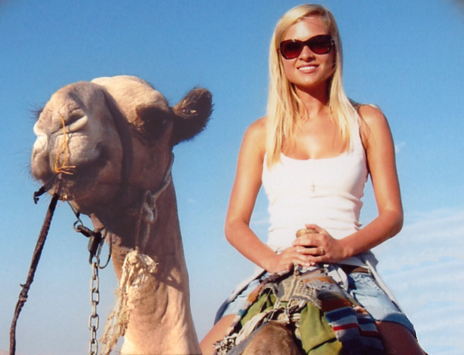 Travel Tips for Women Travelling Abroad Woman on Camel photo