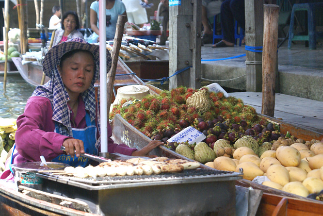 Fast food seller at the Damnoen Saduak Floating Market Bangkok Day Trip Fast food seller