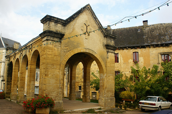 Photo of the charming sandstone covered market in Salignac-Eyvigues in the Dordogne, France market in Salignac-Eyvigues