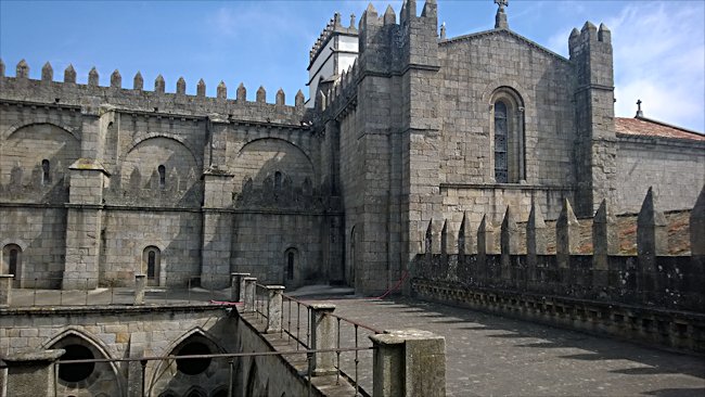 The crenelated walls of the upper cloister promenades
