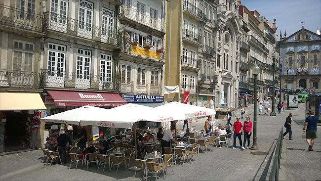 Porto's Sao Bento railway station has some attracive buildings and cafes opposite its main entrance Resturants opposite the main railway station