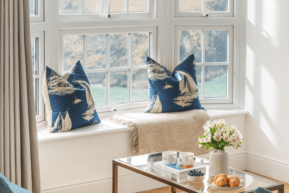 A coffee table and the window seat at Shrimps in Port Isaac, Cornwall.
