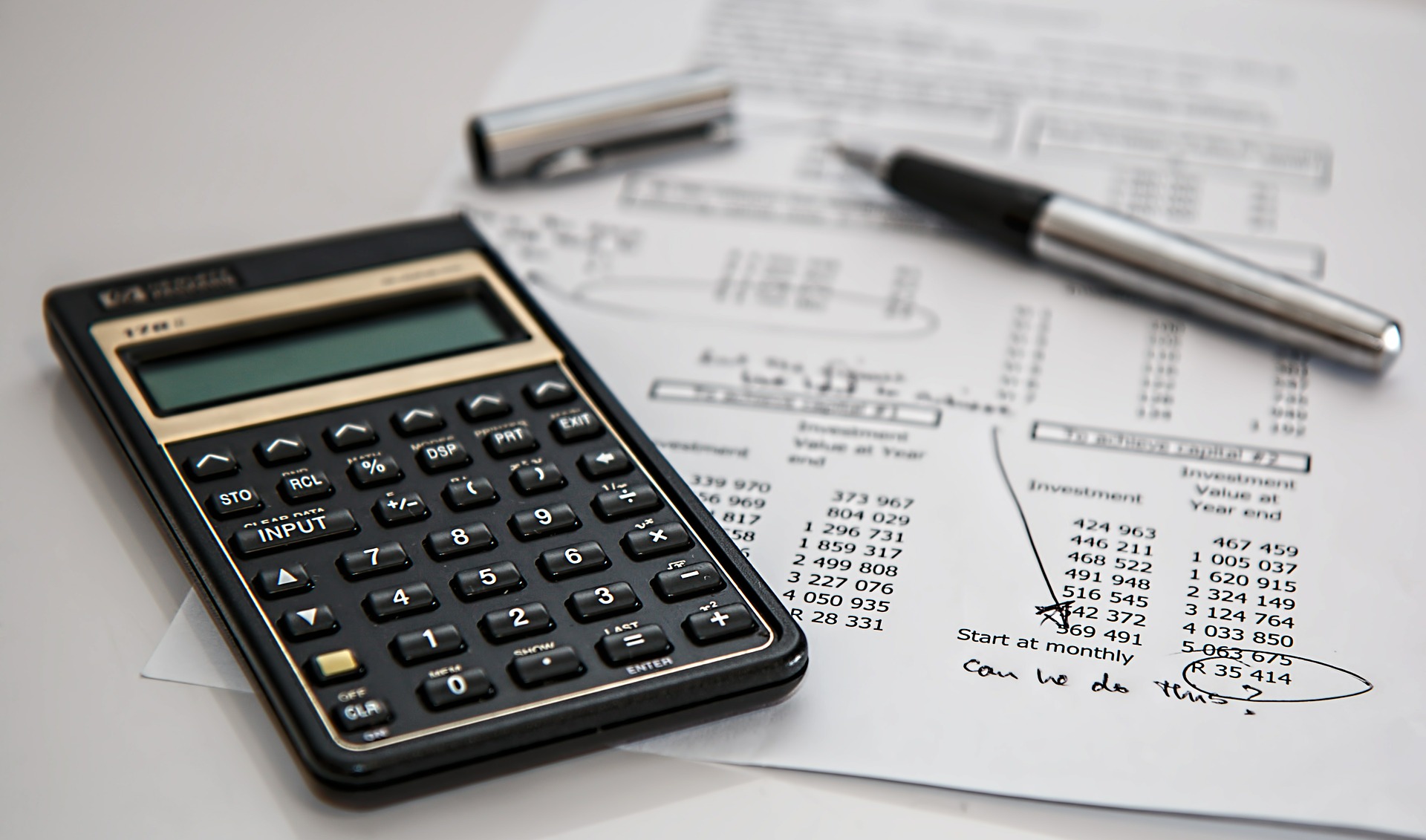 photograph picture of a calculator on a costing sheet