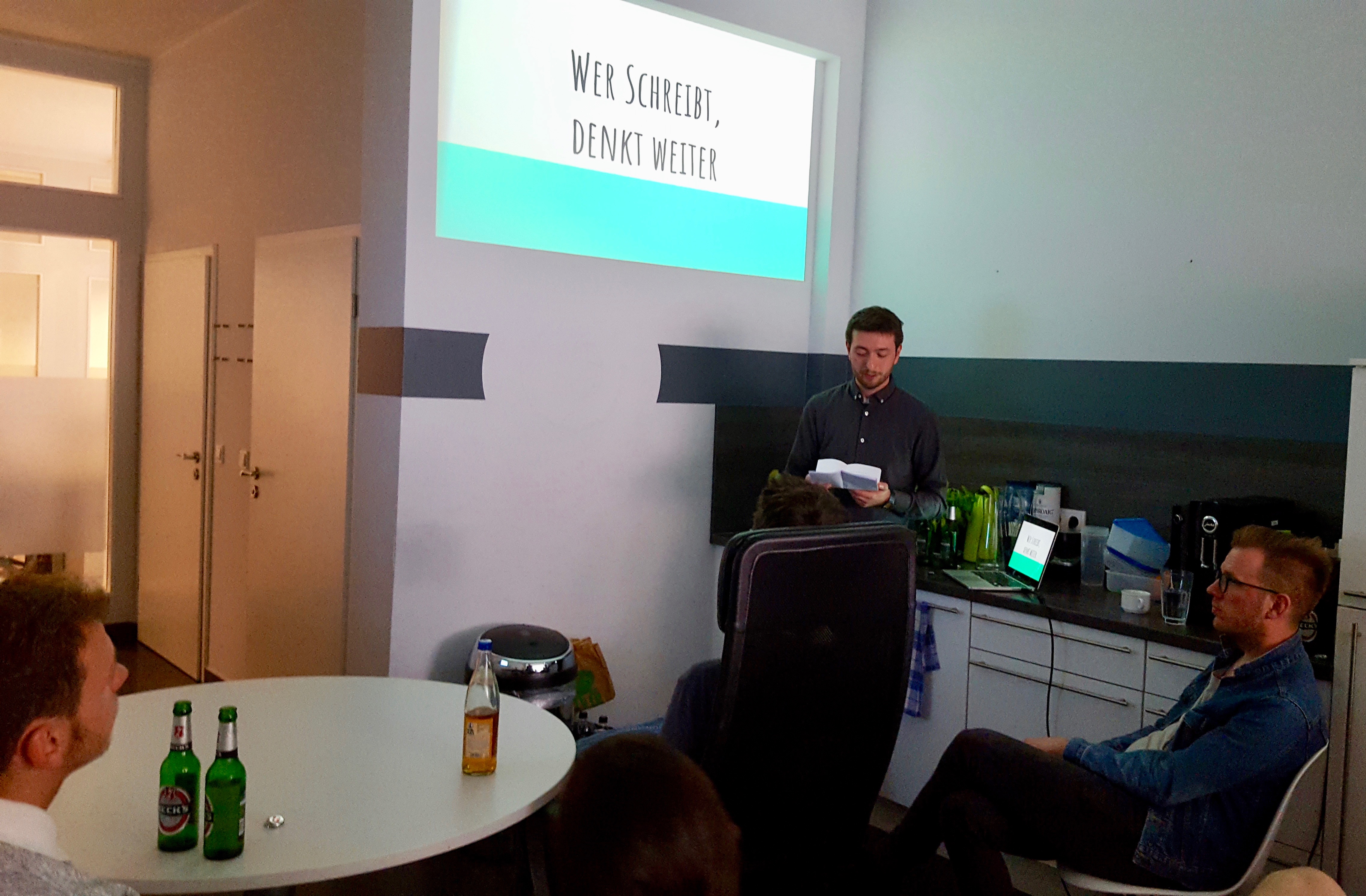 Photo of presentation on the benefits of writing at a Userlike Team event