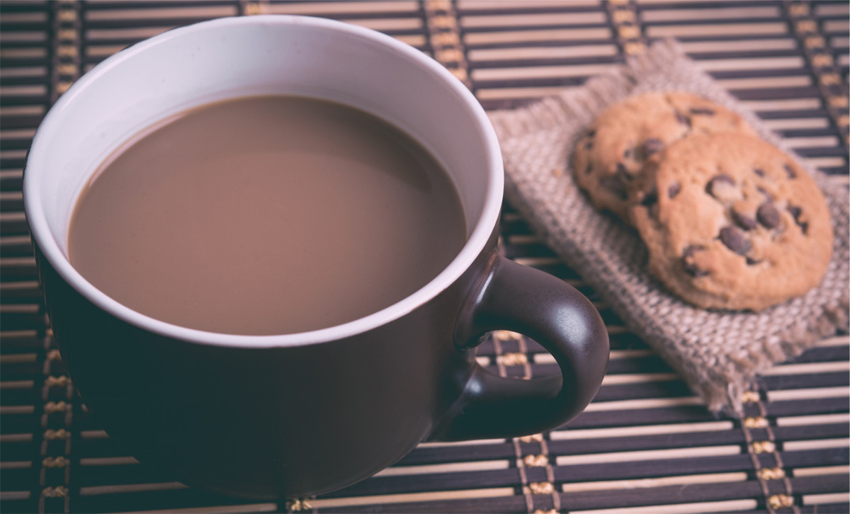 photograph picture of coffee and cookies on a table