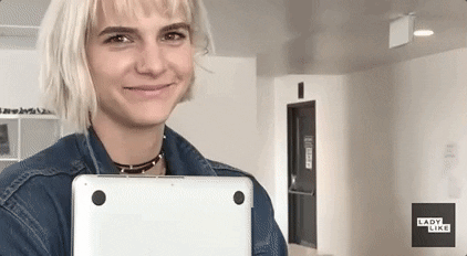 Young woman grinning awkwardly, dubbed with quote maybe.