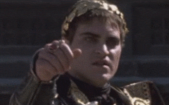 Joaquin Phoenix as Roman Emperor giving a thumbs up.