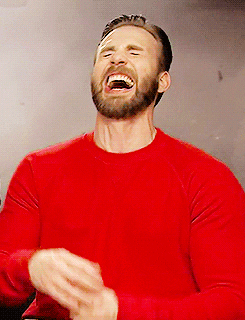 A man laughing exaggeratedly.
