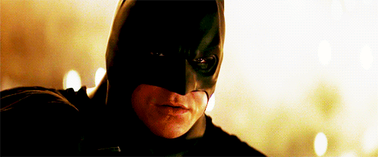 batman flying from a building