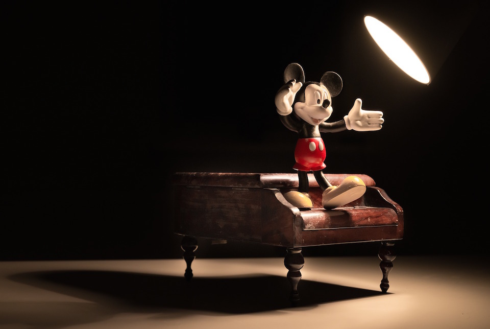 picture of Mickey Mouse on a piano.