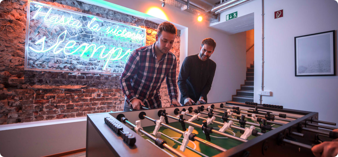 picture of two people playing foosball