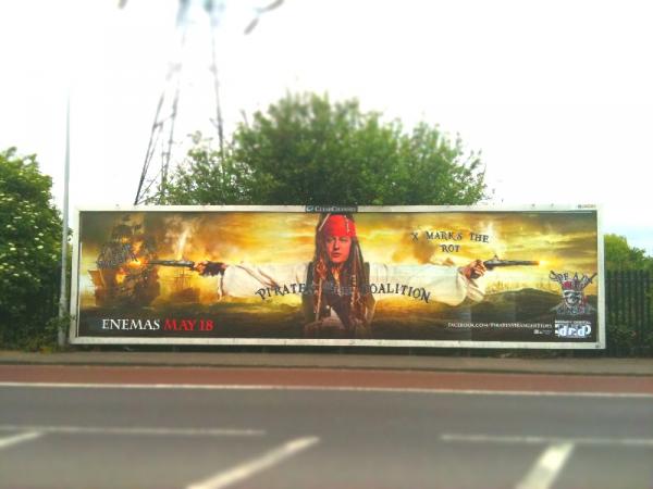 Doctored film poster on a billboard in London