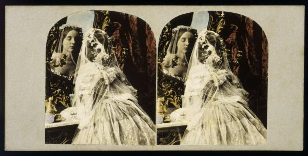 Stereoscopic image of a woman looking in a mirror