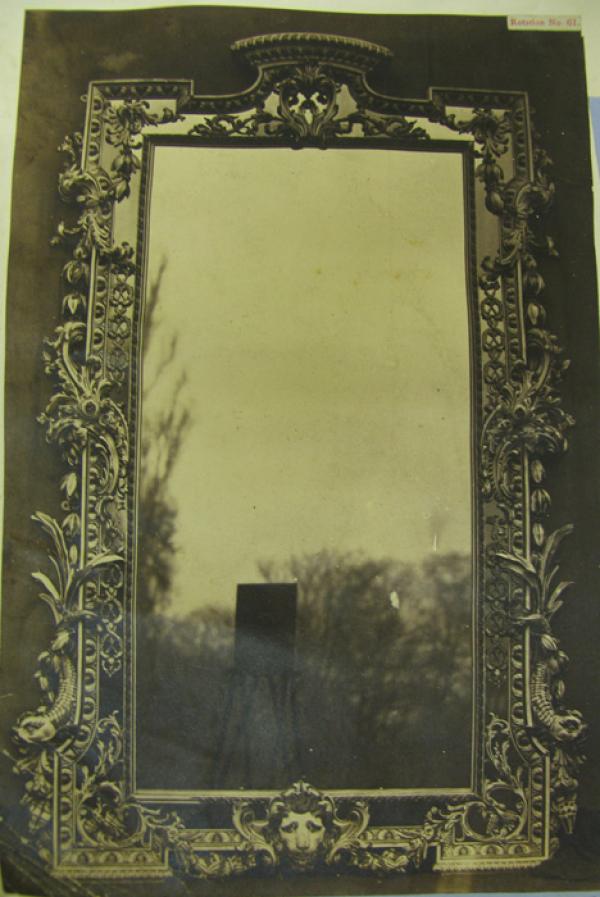 Mirror in carved wood frame. English, date about 1730