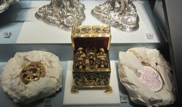 This nécessaire case (V&A 961-1882) had its feet stabilised with Plastizote while paper wads were used to hold the enamelled copper badge (V&A 414:1423-1885) and snuff box (V&A M.230-1917) alongside it © Victoria and Albert Museum, London