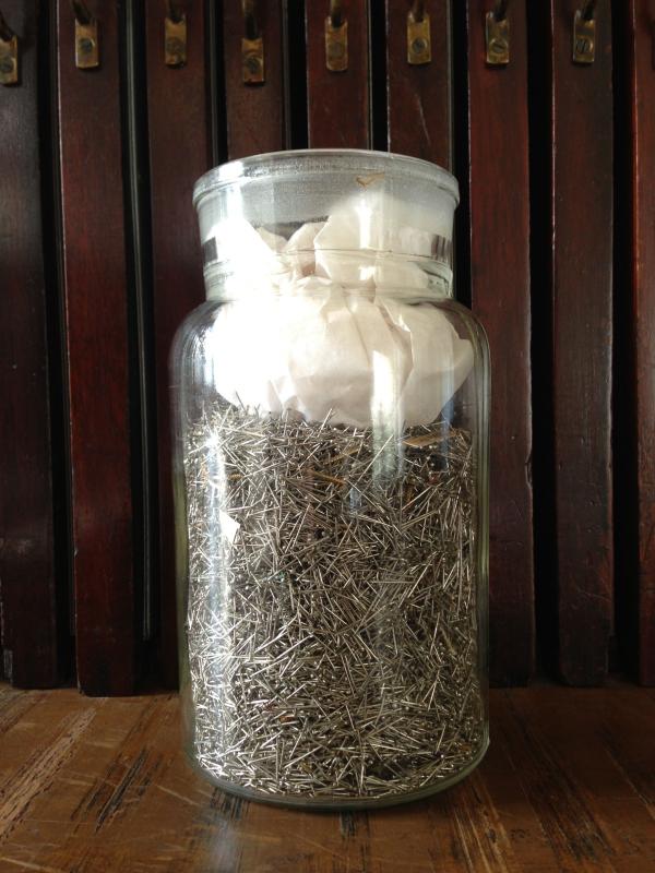 Image of the pins taken from all the textiles previously stitched to the boards of all nine units