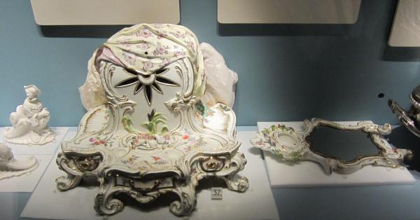 This soft-paste porcelain dressing table mirror had its mirror separated from the stand to prevent possible damage (V&A C.214-1935) © Victoria and Albert Museum, London