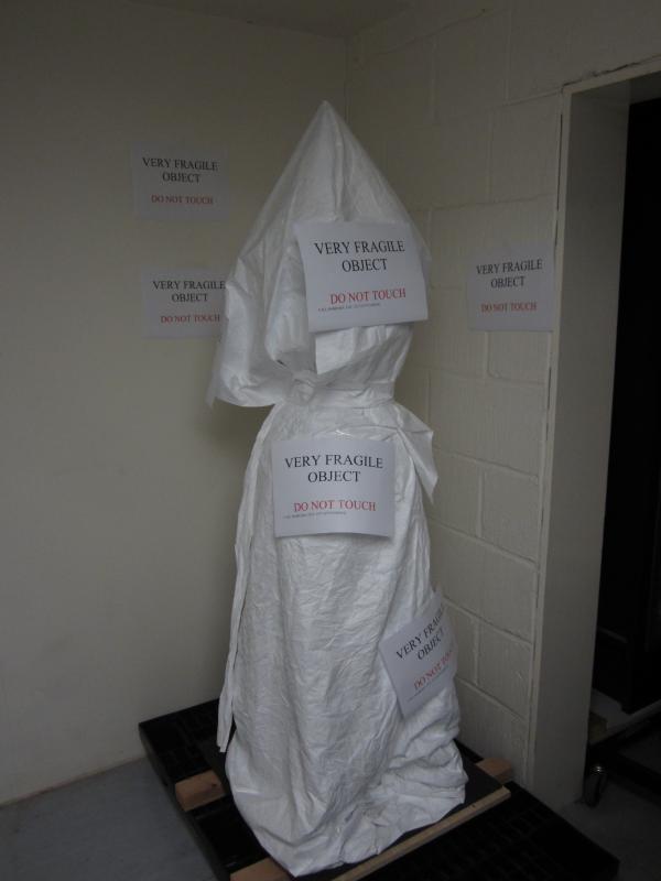 The urn in its temporary position - we are not shy about highlighting which objects are particularly fragile The urn in its temporary position
