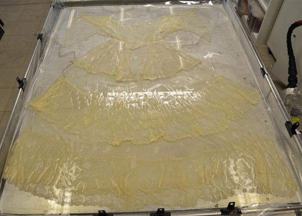 In the wash! The dress was cleaned using conservation grade detergent, for a total of 2½ hours. 