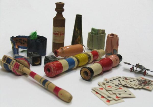 AAD/1998/3/389. Cracker contents, such as paper hats and toys. © Victoria and Albert Museum, London Cracker contents, such as paper hats and toys