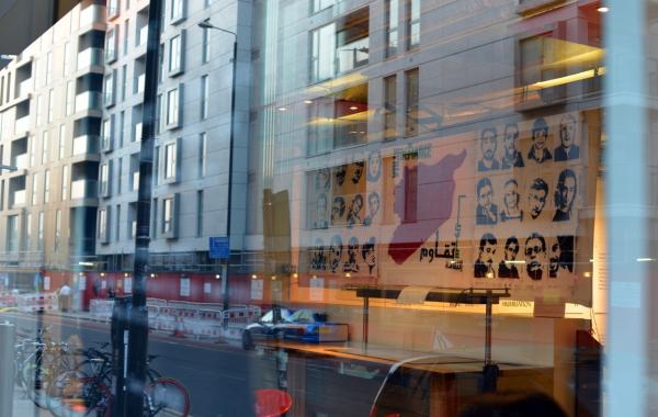 reflection of a banner in the window of the Ricgh Mix Gallery, London