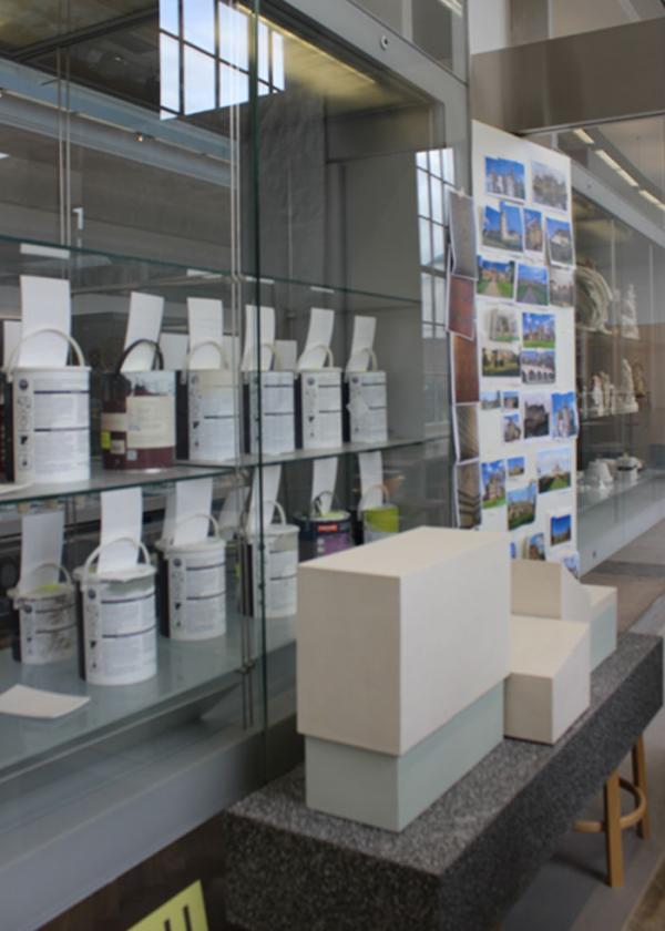 The view from inside the studio, out into the gallery, through James' collection of Museum paint pots © Victoria & Albert Museum james' studio 4