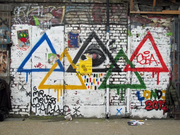 Street art of Olympic rings as triangles