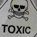 Skull-and-crossbones toxicity warning sign on V&A hats which are thought to have unacceptable levels of mercury in them