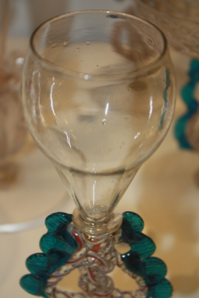 Glass, the stem twisted and tooled with incorporated white and red threads, produced in the Netherlands, 17th Century, C.135-1956. Victoria and Albert Museum, London.
