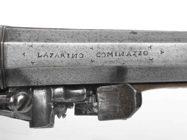 The maker's signature (Lazarino Cominazzo) engraved on the barrel of a mid-17th century carbine gun. V&A M.620-1927