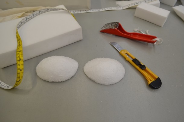 Tools of the costume mounter: tape measure, craft knife, plaztazote blocks, metal grater