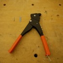 Left to right: rivet, rivet plate, riveter