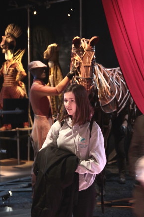 A member of The Rose Youth Theatre looking at the Curtain Up Display © Victoria and Albert Museum, London