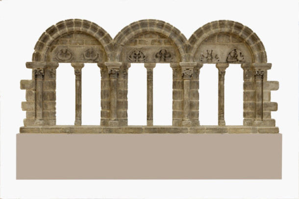 A triple window carved in limestone from a house at Trie-Château
